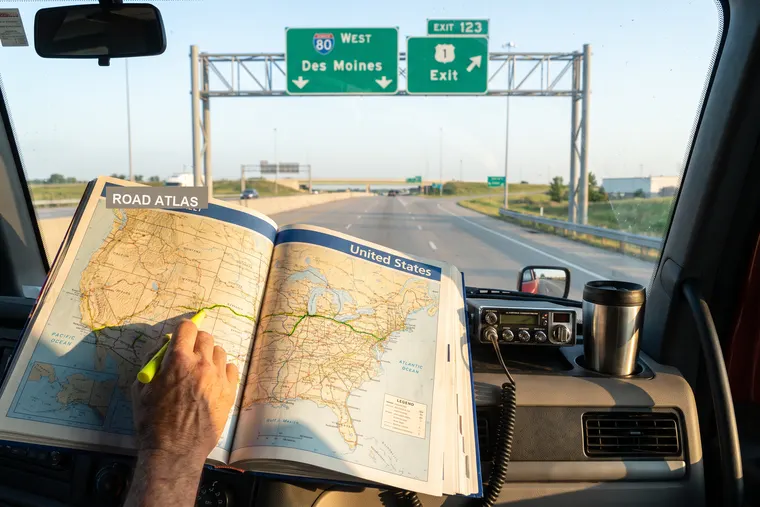 Road atlas with a highlighted route on a truck dash